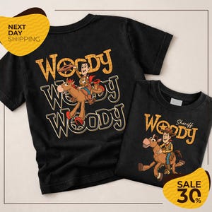a black t-shirt with the character Woody from the Toy Story franchise, along with a smaller t-shirt that appears to be a children's shirt. The t-shirts are displayed together, and there is a sale sign indicating a 30% discount.