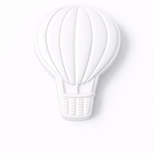 May include: A white, three-dimensional hot air balloon decoration. The balloon has vertical ribbed detailing and a rectangular basket. The object is set against a white background.