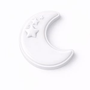 May include: A white crescent moon-shaped decorative object with three embossed stars. The moon has a rounded edge and is set against a white background. The design is simple and elegant, suitable for nursery decor.