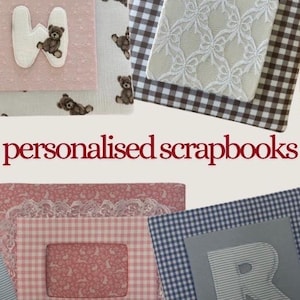 May include: A collection of personalised scrapbooks featuring various fabric covers with patterns including gingham, floral, and teddy bear prints, accented with appliquéd letters and lace details, with the text personalised scrapbooks centred.