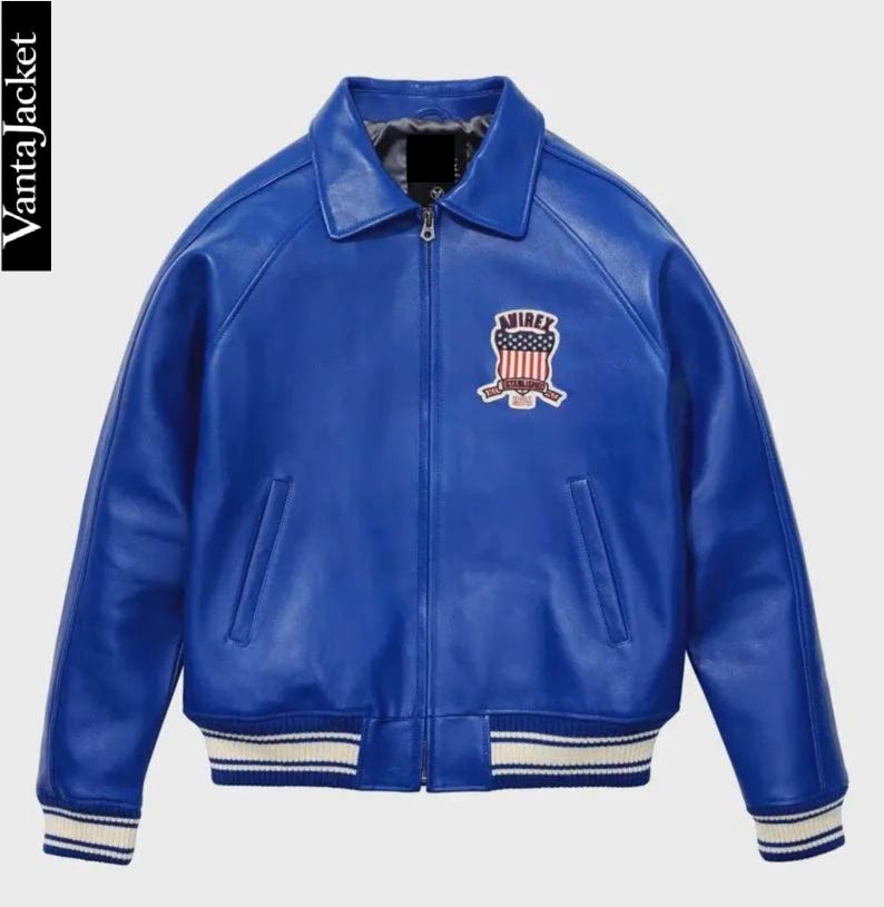 May include: A vibrant blue leather jacket with a classic collar and a zip-up front. Features a patch on the chest with a red, white, and blue design. The cuffs and hem have white stripes. The text "Vanta Jacket" is on the left side.