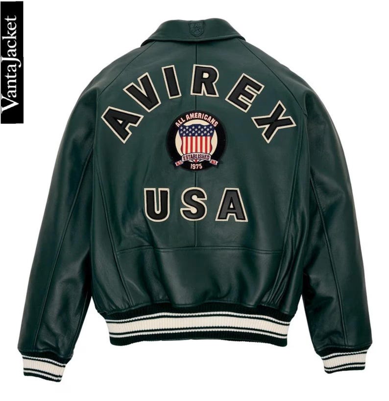 May include: Dark green leather jacket with the word "AVIREX" across the back, above a patch with the American flag and the words "ALL AMERICANS ESTABLISHED 1975". The word "USA" is below the patch. The jacket has white and black striped cuffs and hem.