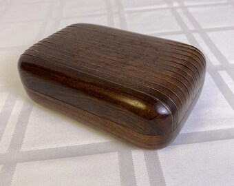 Hand carved 2 piece wood box with metal hinge, hook and metal ribs on lid