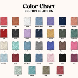 May include: A color chart displaying a variety of Comfort Colors 1717 t-shirts in various colors, including Watermelon, Yam, White, Washed Denim, and Violet. The chart includes the text "Color Chart" at the top.