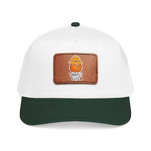 May include: White and forest green baseball cap featuring a brown leather patch with a cartoon bear wearing a ranger hat. The patch has the text "THAT'S FIRE" in white. The cap has a dark green brim and a dark green button on top.