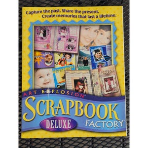 May include: A yellow software box for Art Explosion Scrapbook Factory Deluxe featuring a collage of scrapbook pages with photos of people, a dog, and text that reads: Capture the past. Share the present. Create memories that last a lifetime.