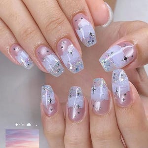 May include: A set of three ceramic nesting bowls in shades of blue, green, and white. The bowls feature a speckled glaze and a simple, modern design. The largest bowl is approximately 7 inches in diameter.