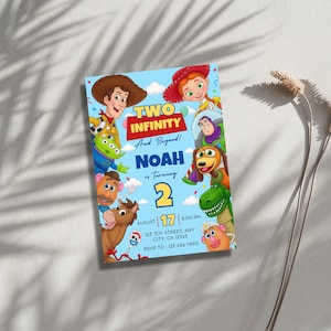 May include: A light blue birthday invitation card featuring Toy Story characters including Woody, Jessie, Buzz Lightyear, Rex, and Mr. Potato Head. The text reads: TWO INFINITY And Beyond! NOAH is turning 2, August 17, 5:00 PM, 123 TOY STREET, ANY CITY, CA 12345, RSVP TO: 123 456 7890.