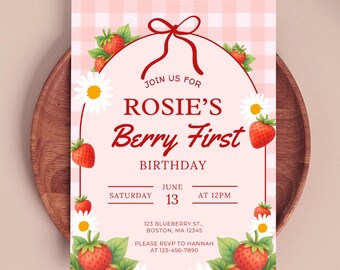 Invitación de primer cumpleaños con temática de fresas, lazos rosas y rojos, plantilla editable (descarga editable en Canva).