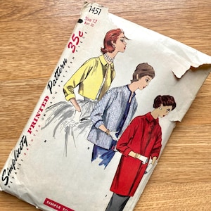 May include: Vintage Simplicity printed pattern envelope. The envelope features illustrations of women in various outfits, including a yellow jacket, a blue patterned jacket, and a red coat. The text on the envelope reads "Simplicity Printed Pattern" and "Size 12 Bust 30".