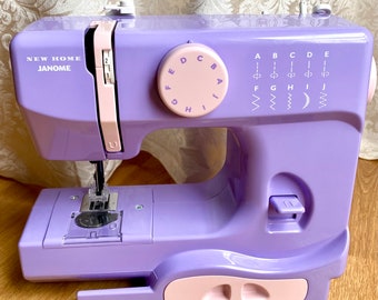 Janome New Home 525B sewing machine in lilac, small portable child-friendly beginner machine