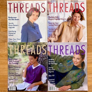 May include: Four copies of Threads magazine, a publication for people who love to sew. The covers feature different models wearing various clothing items and the magazine titles are printed in bold, white letters.
