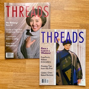 May include: Two copies of Threads magazine, a sewing magazine. The top magazine is the May 1996 issue with a woman wearing a striped sweater on the cover. The bottom magazine is the January 1996 issue with a woman wearing a colourful patchwork coat on the cover. Both covers feature the magazine's title "Threads" and the tagline "For people who love to sew."
