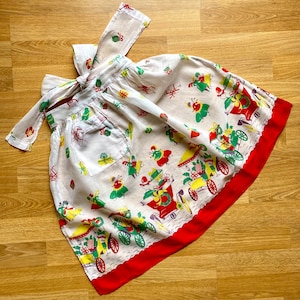vintage Christmas hostess half-apron, old-fashioned print fabric & red border, patch pocket