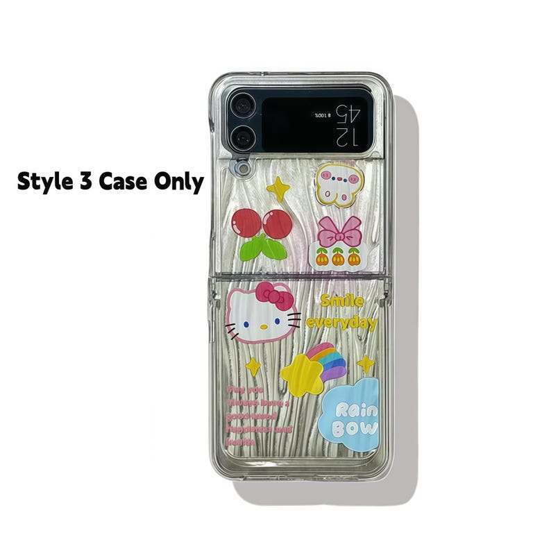 Peut inclure: Coque de t&eacute;l&eacute;phone transparente orn&eacute;e de motifs de dessins anim&eacute;s color&eacute;s, dont des cerises, un n&oelig;ud, un arc-en-ciel et Hello Kitty. Le texte "Smile everyday" et "Rain Bow" sont visibles. L'&eacute;tui est &eacute;tiquet&eacute; "Style 3 Case Only".