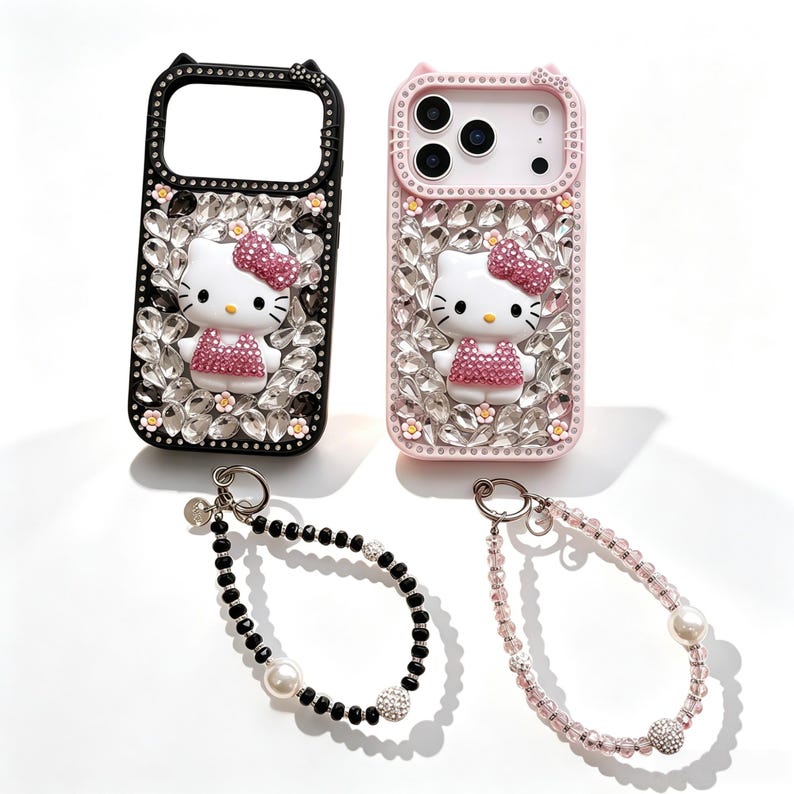 May include: Two phone cases, one black and one pink, each adorned with a Hello Kitty figure and sparkling crystals. Below, two beaded wrist straps, one black and one pink, with pearl and crystal accents.