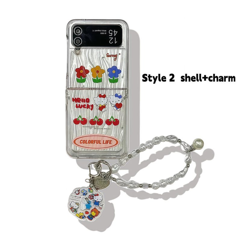 Peut inclure: Coque de t&eacute;l&eacute;phone transparente avec des motifs floraux et Hello Kitty. Comprend une dragonne perl&eacute;e et un charm avec des personnages Hello Kitty. Le bo&icirc;tier porte les inscriptions "Hello Lucky" et "Colorful Life".