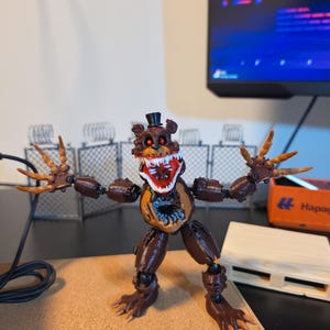 Nightmare fredbear figure - Etsy 日本