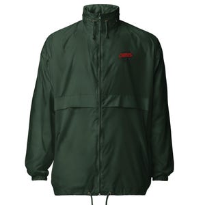 May include: A dark green windbreaker jacket with a full front zipper, a stand-up collar, and a drawstring hood. The word "CHAOS" is printed in red on the upper chest area. The jacket has two front pockets and elastic cuffs.