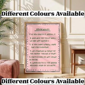 May include: A rectangular wall art print in a wooden frame featuring a pink background with a dark grey border and green text. The text reads: HOUSE RULES, 1. IF YOU EMPTY IT, REFILL IT. 2. REPLACE THE TOILET ROLL. WE ARE NOT ANIMALS. 3. IF YOU MAKE A BREW, MAKE ONE FOR EVERYONE. 4. NO STANDING IN FRONT OF THE FRIDGE "HAVING A THINK". 5. DIRTY DISHES DO NOT COUNT AS DÉCOR. 6. WHOEVER KILLS THE SPIDER BECOMES HEAD OF SECURITY.