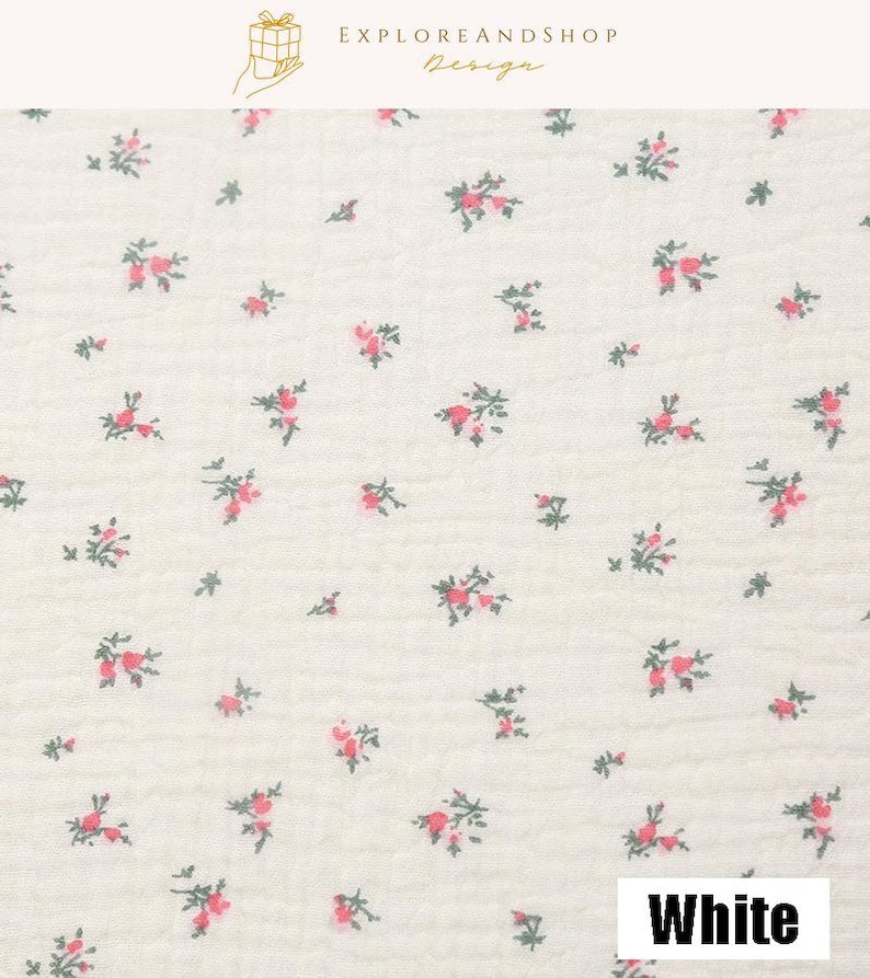 May include: White fabric with a delicate floral pattern. Small clusters of pink flowers with green leaves are scattered across the off-white background. The word "White" is displayed in a white box at the bottom.
