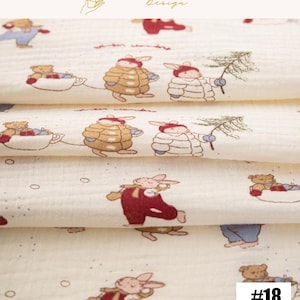 May include: Off-white fabric with a repeating pattern of cartoon bunnies, bears, and winter scenes. The bunnies wear red overalls and the bears are in teacups. The fabric has a soft, textured appearance. The text "EXPLOREANDSHOP Design" is at the top.