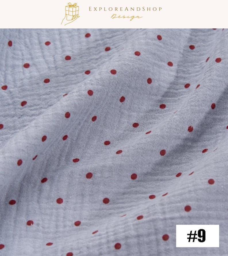 May include: Close-up of a light blue fabric with a crinkled texture, adorned with evenly spaced, dark red polka dots. The fabric is slightly wrinkled, creating subtle shadows. The number "#9" is in the bottom right corner.