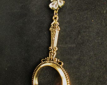 Golden Hand Magnifying Glass Necklace