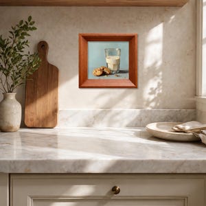 Hand painted oil artwork of a glass of milk and chocolate chip cookies, displayed in a warm wooden frame on a sunlit kitchen countertop, ideal for farmhouse kitchen decor, tabletop display, or gifting mom, wife, friend, foodie, or coffee lover, highlighting realistic cookie textures, handcrafted brushstrokes, and cozy breakfast inspired still life composition.