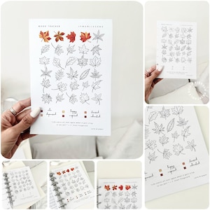 Op de afbeelding: Een wit papieren mood tracker-vel met een raster van diverse bladillustraties in zwarte omtrek, met vier gekleurde bladeren bovenaan. Het bevat een kleurgecodeerde legenda voor stemmingen en het citaat: Life starts all over again when it gets crisp in the fall.