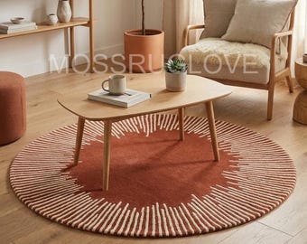 Roest rond zonnestraaltapijt, rond tapijt verbrand oranje, handgetuft tapijt met radiaal patroon, boho aardetinten rond vloerkleed