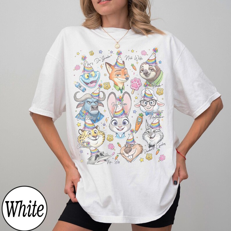 May include: White t-shirt featuring colorful cartoon character portraits with party hats. The design includes a bunny, fox, sloth, and other animals. The word "White" is printed on the bottom left.
