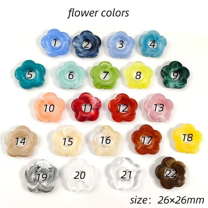 May include: A collection of twenty-two flower-shaped beads arranged in rows, each labeled with a number from 1 to 22. The beads feature various solid and marbled colors, including blue, green, red, yellow, pink, brown, and clear. Size: 26x26mm.