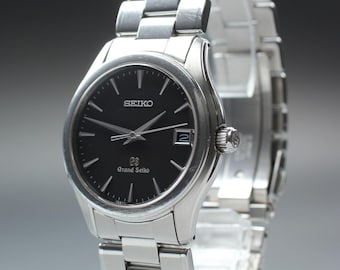 Near mint grand seiko gs 9f62-0a10 black dial date 35mm quartz men's watch japan