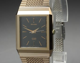 Vintage 1980 near mint citizen exceed 4-795725 black gold 26mm quartz mens watch