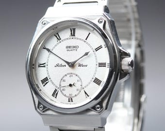 Vintage 1982 near mint seiko silver wave 2628-0060 roman small second qz men's