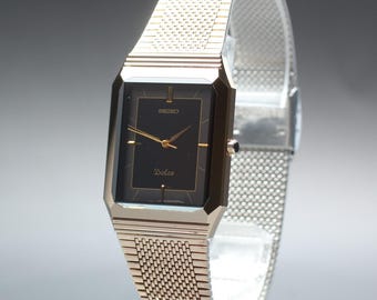 Vintage 1986 near mint seiko dolce 7741-5080 black gold tank qz mens watch japan