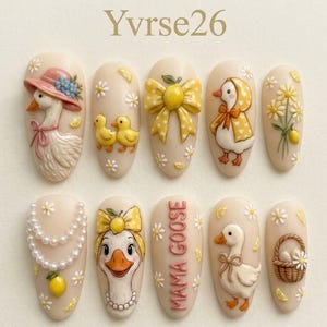 May include: A set of ten almond-shaped artificial nails with a light beige base, featuring 3D goose and duck designs. The designs include a goose wearing a hat, a yellow bow, and the text "MAMA GOOSE".