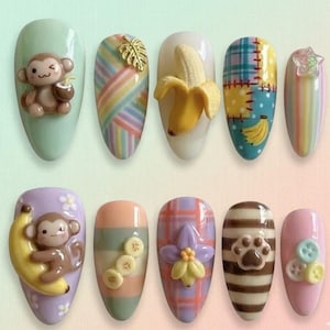 May include: A set of three ceramic mugs with a speckled, matte finish. The mugs are in shades of cream, light gray, and dark gray. Each mug has a simple, minimalist design and a rounded handle.