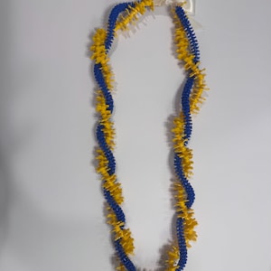 May include: A set of three ceramic mugs with a speckled, matte finish. The mugs are in shades of cream, light gray, and dark gray. Each mug has a simple, minimalist design and a rounded handle.