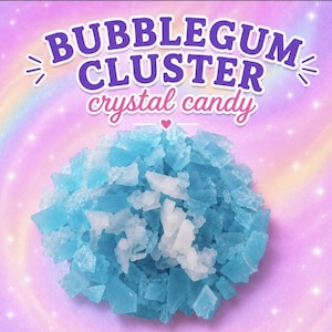 May include: A pile of light blue and white crystal candy pieces centred on a pastel rainbow background. The text BUBBLEGUM CLUSTER crystal candy is printed in purple and pink above the candy, with a small heart icon below the text.