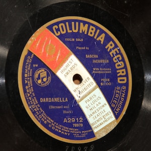 May include: A gold and blue Columbia Record label with the text "Columbia Record Symphony Series" and "Dardanelle (Bernard and Black)". The label also includes the text "A2912 78979" and "Price $1.00".