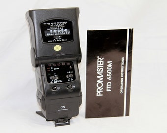 Promaster FTD 6500M Flash - Canon CN Flash - Electronic Camera Flash - Motorized Zoom - Stand - Instructions - Like New, Working Condition