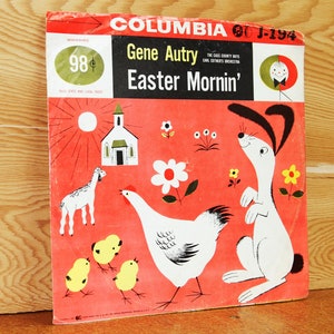 May include: A red and white record cover with a cartoon illustration of a rabbit, a hen, and chicks. The cover features the text "Columbia", "Gene Autry", "Easter Mornin'" and "98 cents".
