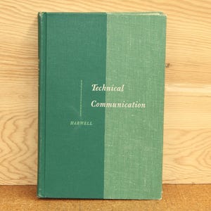 May include: A green hardcover book with the title "Technical Communication" and the author "Harwell" printed on the front cover.