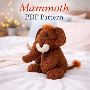 May include: A crocheted brown mammoth plush toy with cream-colored tusks and a tuft of orange hair. The text "Mammoth PDF Pattern" is displayed in red and blue. The toy is sitting on a white surface.