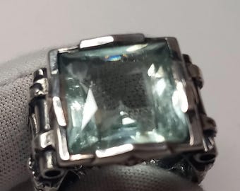 Anillo de plata para hombre con aguamarina de 25 quilates, 12 diamantes negros y 2 diamantes blancos.