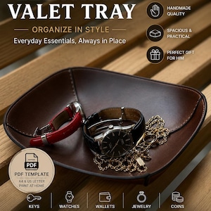Könnte beinhalten: Eine dunkelbraune Lederablage mit einer silbernen Armbanduhr mit schwarzem Lederarmband, einem roten Uhrenarmband und einer Goldkette. Das Bild enthält den Text: LEATHER VALET TRAY, PDF TEMPLATE, A4 & US LETTER PRINT AT HOME, KEYS, WATCHES, WALLETS, JEWELRY, COINS.