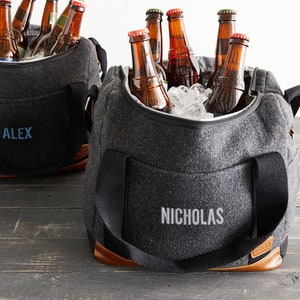 Each soft-sided cooler bag is customized to make it both fashionable and functional. The material combines wool/poly and vinyl accents! A complimentary bottle opener and a 12 bottle collapsible die-cut insert are included in every order.