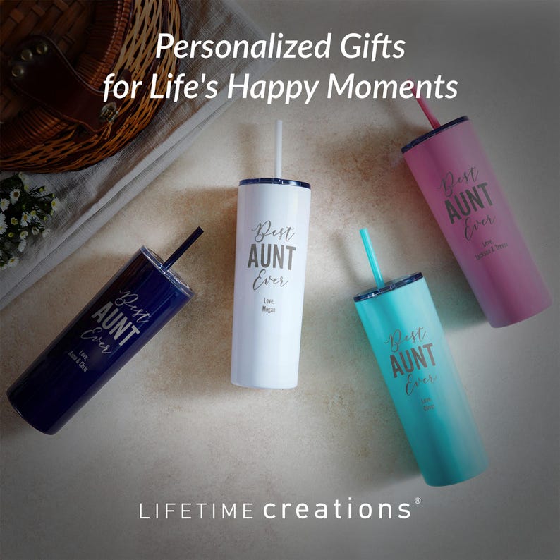 May include: Four tall cylindrical tumblers with lids and straws in navy blue, white, turquoise, and pink. Each tumbler features the text Best AUNT Ever and personalized names printed in a script and sans-serif font. The text Personalized Gifts for Life's Happy Moments and LIFETIME creations appear on the image.